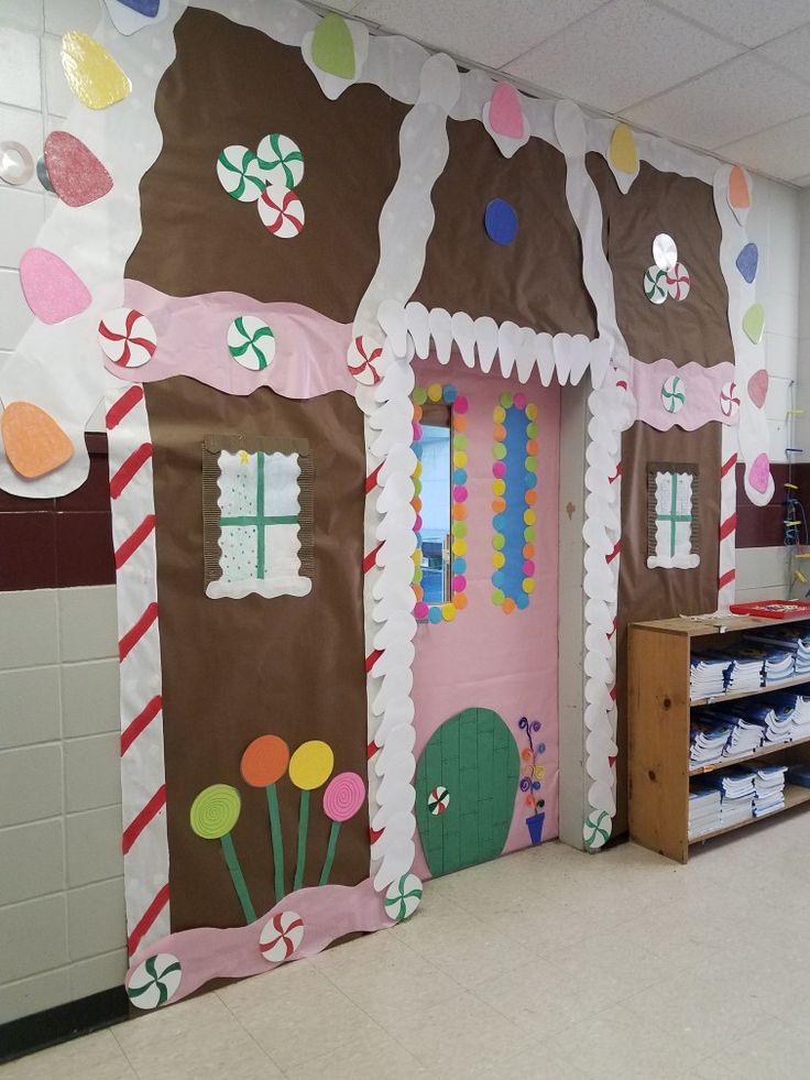 a classroom decorated for christmas with gingerbread houses and candy canes on the doors