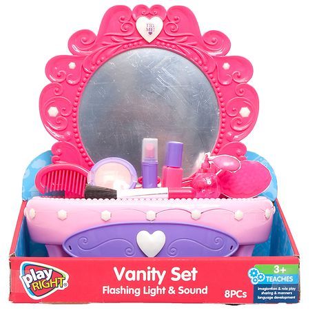 a pink vanity set in a red box