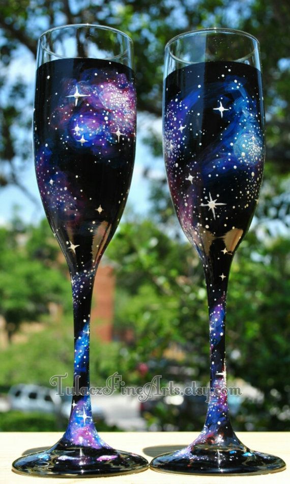 two wine glasses with stars painted on them