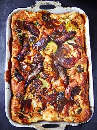 a casserole dish filled with meat and vegetables