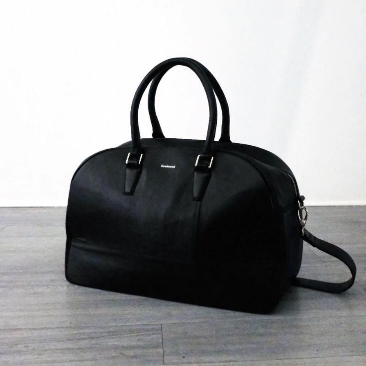 100% Genuine Leather No Tag Timeless Black Satchel For Travel, Timeless Black Bags With Leather Handles, Elegant Everyday Duffle Bag With Leather Handles, Timeless Black Shoulder Bag With Leather Handles, Timeless Black Satchel For Daily Use, Elegant Black Duffle Bag For Everyday Use, Elegant Black Duffle Bag For Everyday, Classic Black Textured Leather Travel Bag, Classic Black Weekender Bag For On-the-go