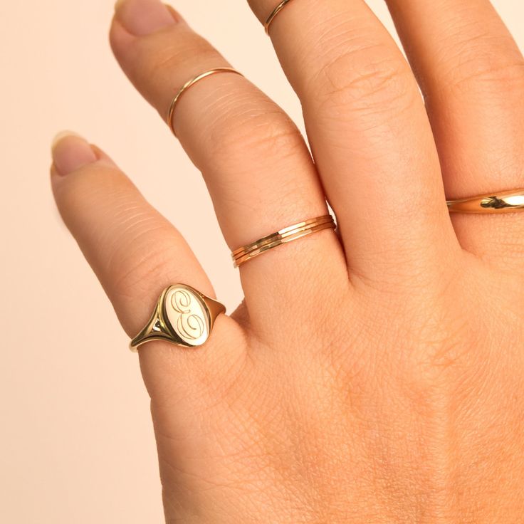 Timeless Rounded Sterling Silver Jewelry, Timeless Sterling Silver Jewelry, Dainty Stackable Yellow Gold Signet Ring, Timeless Adjustable Oval Rings, Stackable Oval 14k Gold Jewelry, Polished Rounded Promise Ring Jewelry, Timeless 14k Gold Stackable Rings As Gift, Elegant 14k Stamped Midi Rings For Anniversary, Elegant Sterling Silver Ring