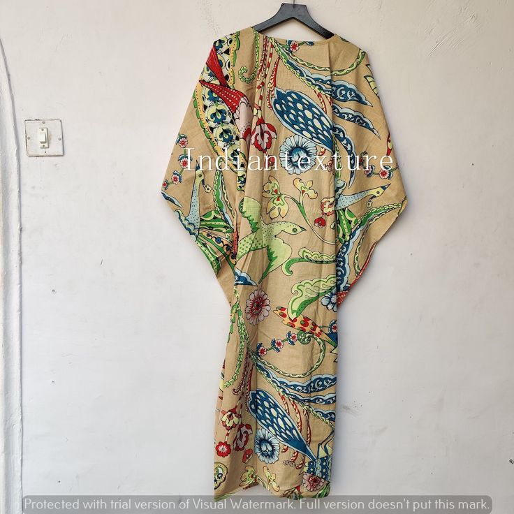 "This Beautiful Indian Cotton Caftan or can be called as Tunic is made with super fine quality cotton and designs have been crafted by Hand Prints. Measurements :- Size - Free Size Length -130 Cm /52\" Inches Bust/chest size - 120 CM/ 48\" Inches Fabric - 100% Cotton Pattern - Floral Kaftan has Adjustable Drawstring Waist to loose or tight , Kaftan has V Shape Neck Which is 8\" Inches Deep. Kaftan Is Multi-purposeand can be worn as a cover up at the Beach ,Loumge wear ,sleepwear ,Pregnant Women Fitted Long Sleeve Kaftan For Beach, Long Patterned Kimono For The Beach, Fitted Long Kaftan For Vacation, Fitted V-neck Kaftan For Vacation, Fitted Printed Kimono For The Beach, Fitted Kaftan For Vacation In Spring, Beach Fitted Printed Kimono, Patterned Long Kaftan For Beach, Long Patterned Kaftan For Beach