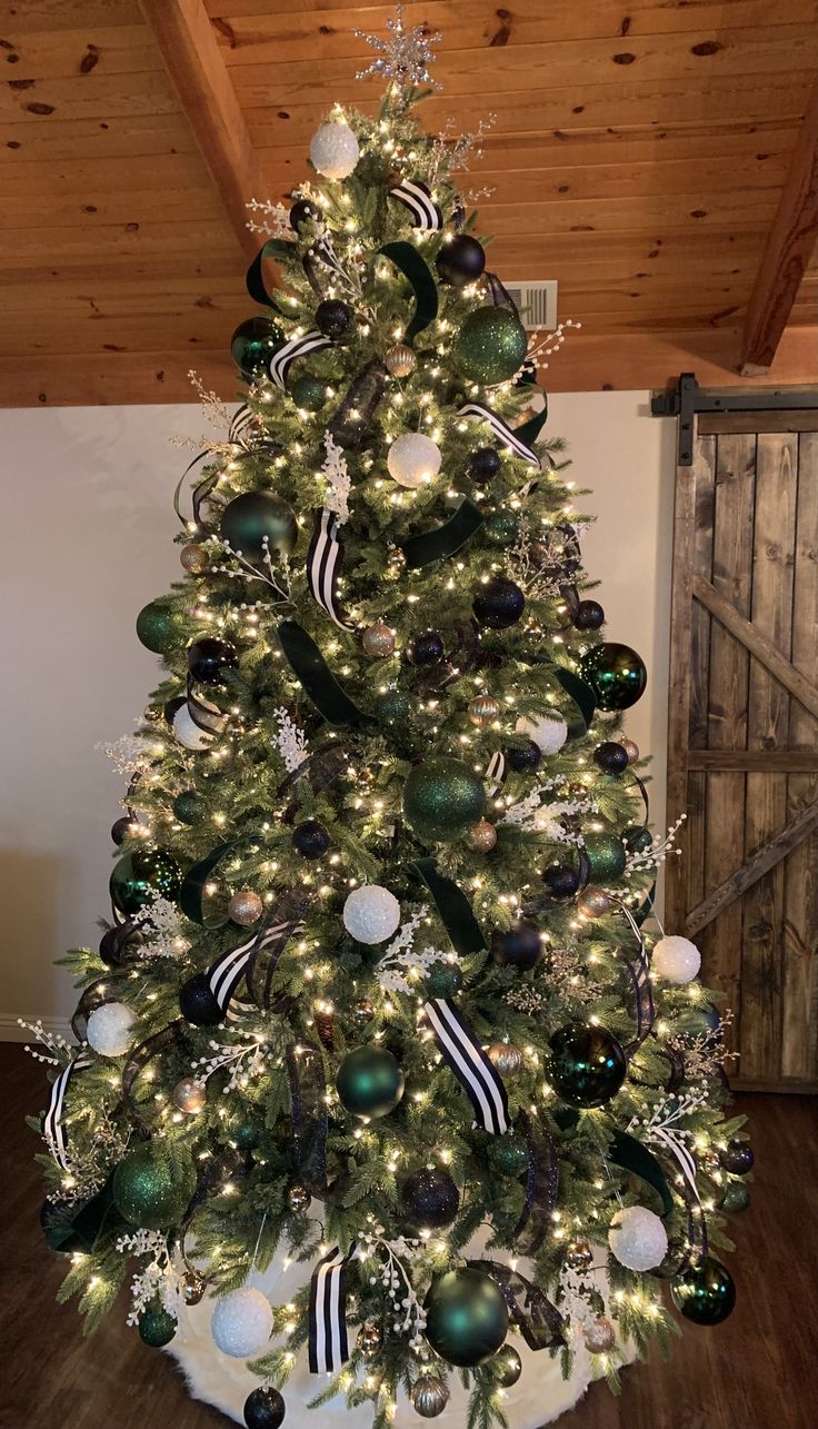 a decorated christmas tree with black and white ornaments