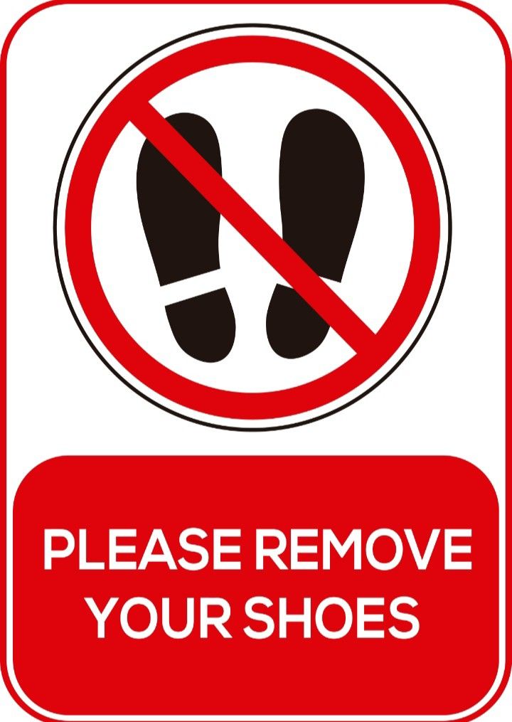 a red and white sign that says please remove your shoes on the bottom right hand side