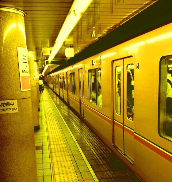 a subway train is stopped at the station