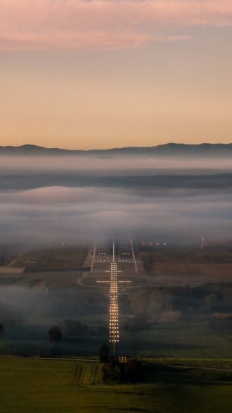 an airplane is flying over the clouds in the sky