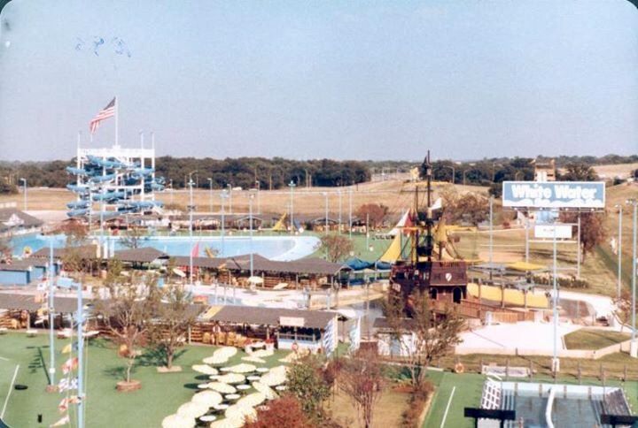 an aerial view of a park with water slides