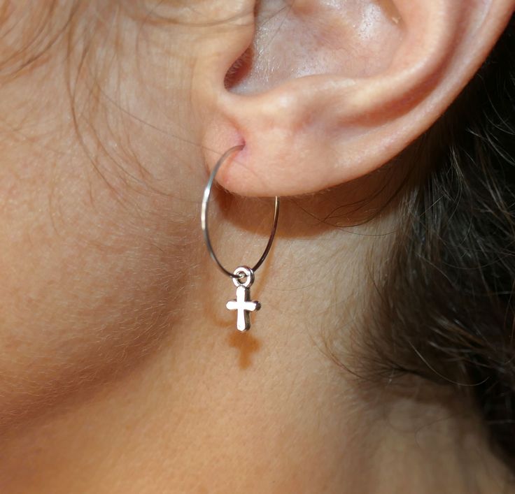 Small cross charm hoop earrings. Earring length: 30mm Cross size: 10mm x 5mm Earing loop material: 316 L stainless steel Earing loop diameter: 20mm This listing is for one pair of cross earrings. These earrings will come in a gift bag. I offer combined shipping costs which give you a shipping discount for ordering multiple items from my shop. Earrings care: Take them off while you sleep, do sports activities, bathe, having a shower. Avoid contact with chemicals, and high temperatures. Avoid viol Single Surgical Steel Hoop Earring As A Gift, Small Hoop Surgical Steel Earrings For Gift, Small Hoop Surgical Steel Earrings As Gift, Surgical Steel Small Hoop Earrings For Gifts, Small Hoop Earrings In Surgical Steel As Gift, Nickel Free Surgical Steel Hoop Earrings, Nickel-free Surgical Steel Hoop Earrings, Nickel-free Cross Hoop Earrings As Gift, Small Loop Earrings