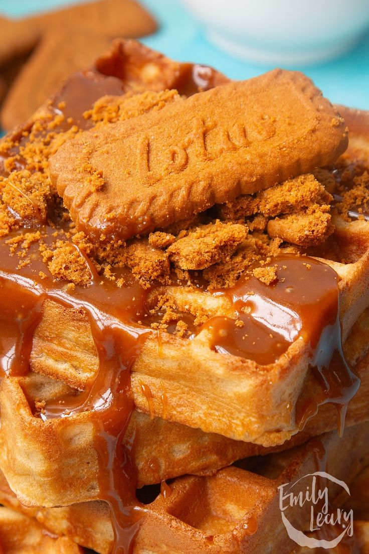 a stack of waffles covered in caramel sauce