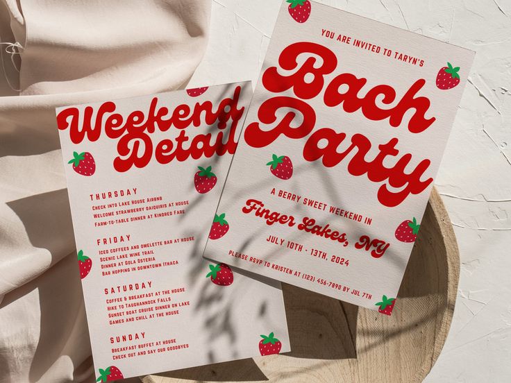 two red and white party flyers sitting on top of a wooden plate