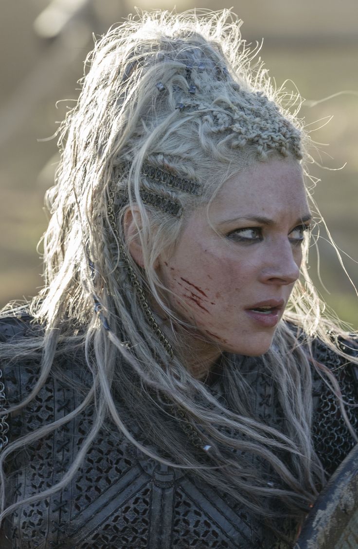 Lagertha was the first and ex-wife of Ragnar Lothbrok and the former Queen of Kattegat. Lagertha was an Earl, and a fierce shield-maiden. She fought in the shield-wall alongside the men. Since the loss of her daughterGyda and her unborn child with Ragnar, Lagertha realized that Freyja's fertility is meant for another, and that it is the goddess' warrior aspect that speaks to her fellow Valkyrie. Lagertha remained fiercely independent when it came to protecting her family—and the throne, before b Vikings, A Woman, Braids, Queen, Google Search, Free Shipping, Hair, Plaits