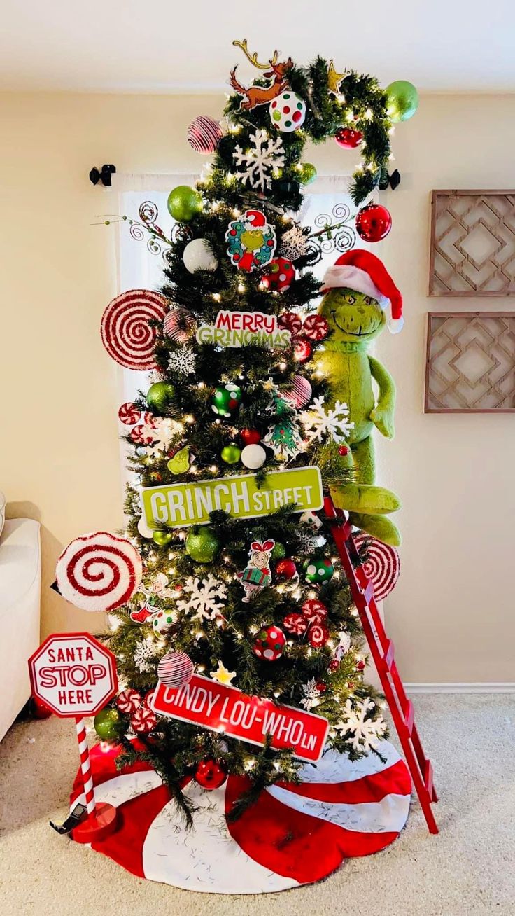 a christmas tree decorated with candy canes, ornaments and other holiday decorating items