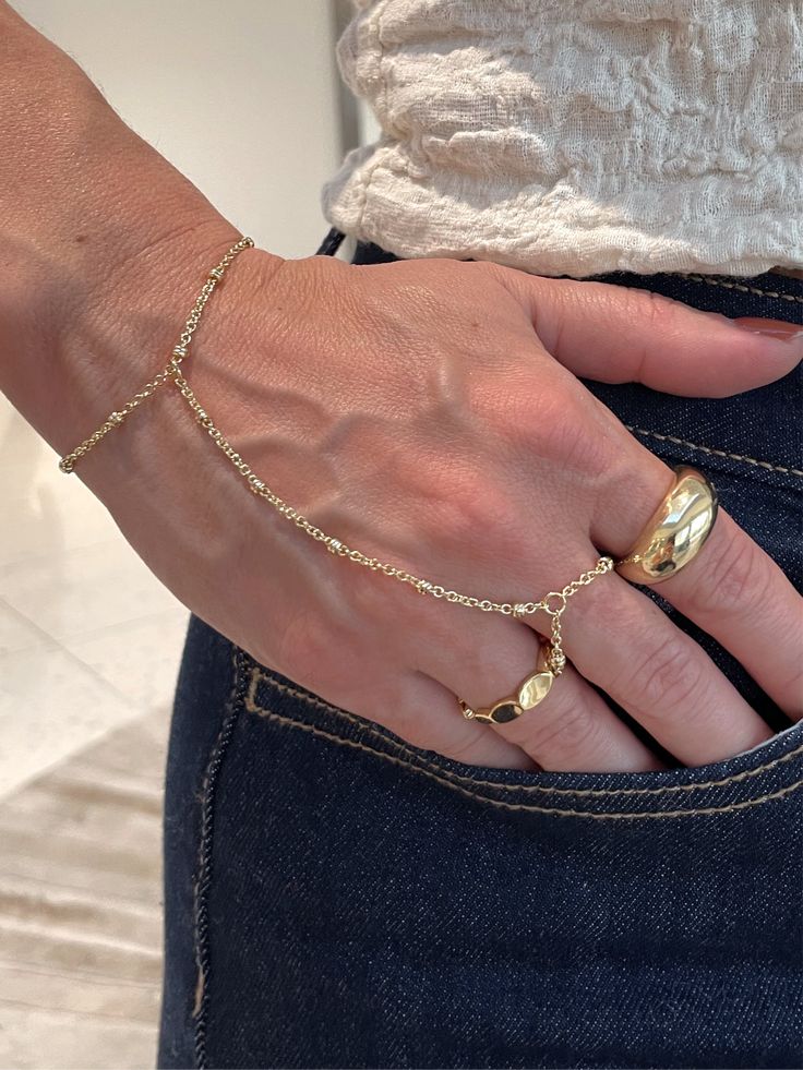 Elevate your style with our Cecilia bracelet. This trending piece boasts a gold-plated design that adds a touch of sophistication to any outfit. Stand out from the crowd and make a statement with this must-have accessory. Ring Bracelet, Earring Necklace, Ring Gift, Necklaces Bracelets