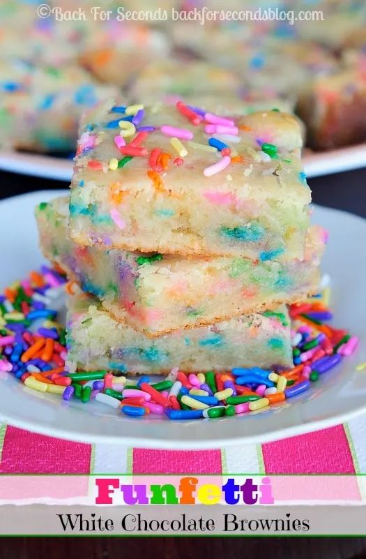 white chocolate brownies with sprinkles on a plate