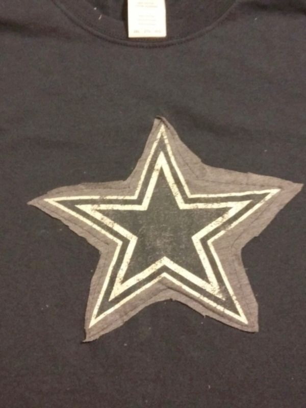 a black shirt with a silver star on it