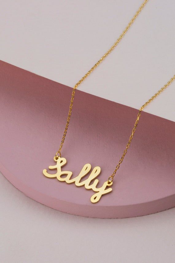 14k 18k 10k Solid Gold Minimal Gold Name Necklace, Custom Word Necklace, Personalized Name Jewelry for Women, Birthday Gift for Mom FEATURES• Solid Gold (real gold, not gold plated or gold filled material)• Gold Karat: 10K (417) - 14K (585) - 18K (750) (optional)• Pendant Height: 0.35 Inches (0.90 cm)• Pendant Width: depending on the text• Available Gold Color: Yellow gold, rose gold and white gold (optional)Wholesale requests are welcome.Our gold necklaces are perfect choice for a Christmas, Mo Gold Nameplate Necklace For Birthday, Gold Nameplate Necklace For Birthday Gift, Gold Hallmark Nameplate Necklace, Gold Nameplate Necklace With Hallmark, Classic Name Necklace With Hallmark For Anniversary, Gold Hallmarked Nameplate Necklace, 14k Gold Necklaces With Hallmark For Birthdays, Yellow Gold Name Necklace For Birthday Gift, Classic Nameplate Necklace For Birthday