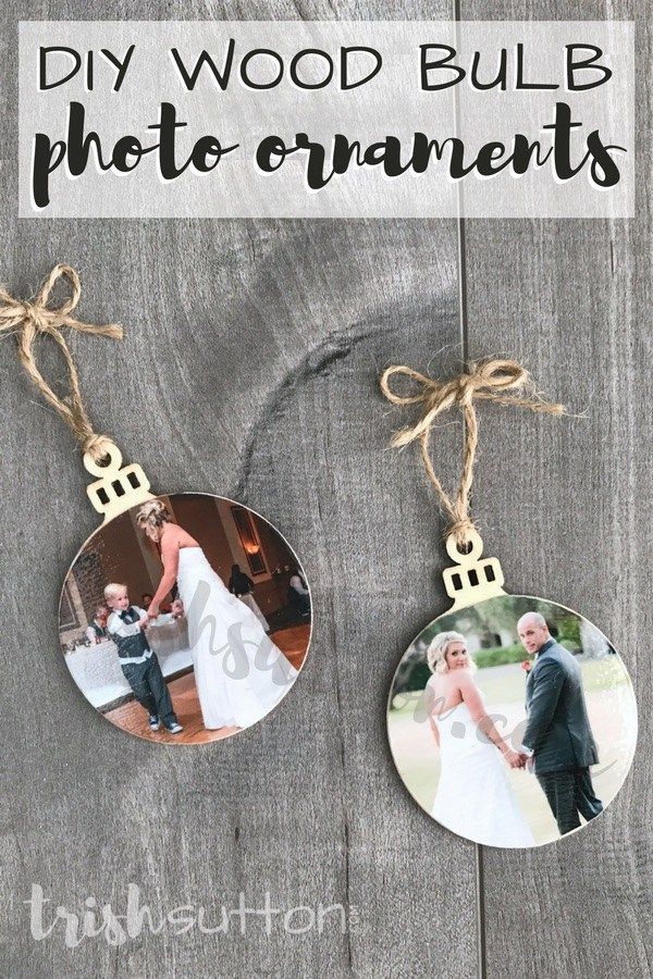 an ornament hanging from a wooden board with the words diy wood bulb photo ornaments