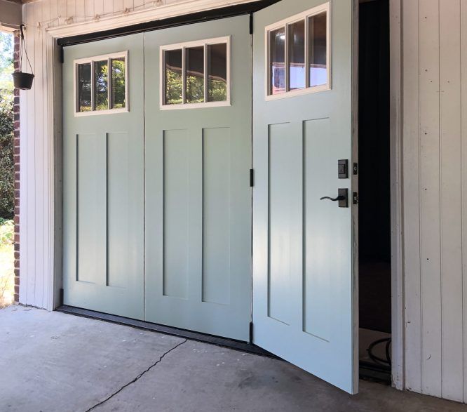 a garage door with two windows on each side