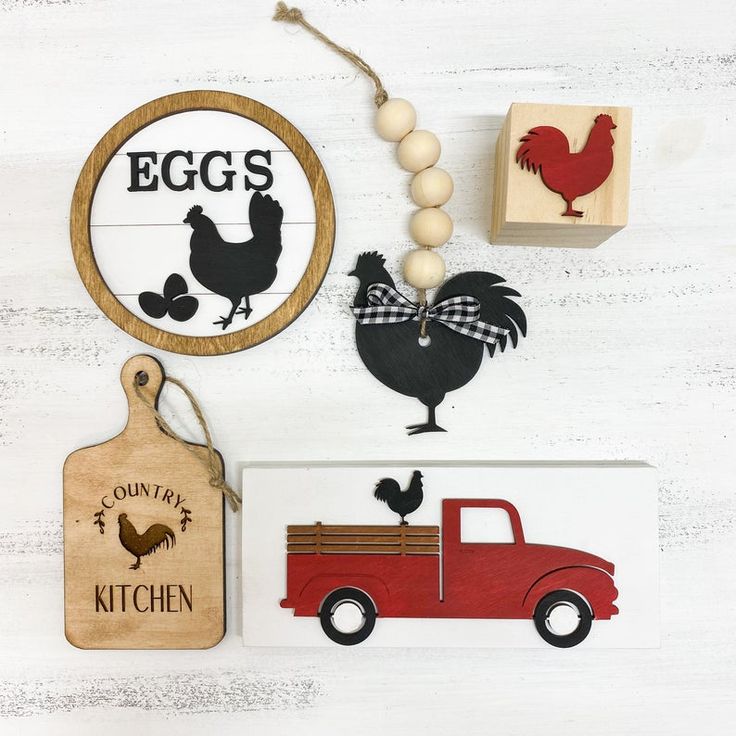 an assortment of wooden toys and magnets on a white background with chicken, rooster, truck