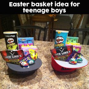 two hats sitting on top of a table filled with snacks and candy bar wrappers