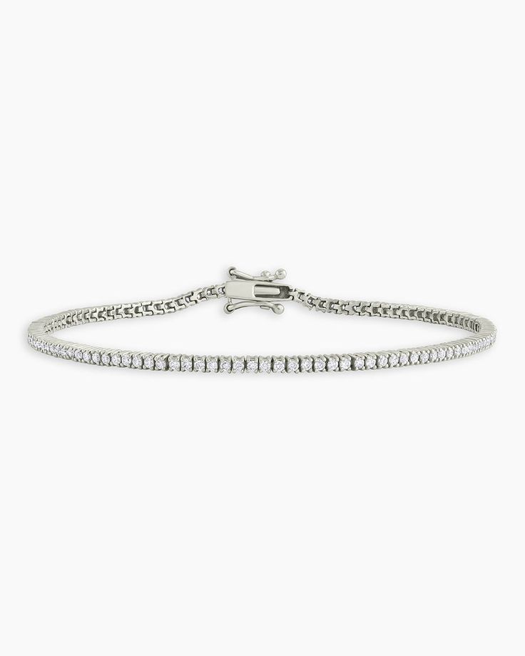 Achieve a truly timeless look with the Melbourne Diamond Tennis Bracelet. This gorgeous solid white gold tennis bracelet features a timeless, diamond encrusted design that is perfect for any occasion. To wear, stack alongside other white gold or diamond bracelets. More is more! Melbourne Diamond Tennis Bracelet in 14k Solid White Gold/6.5, Women's Size 6.5 in. by gorjana Timeless Wedding Tennis Bracelet With Pave Setting, Timeless Tennis Bracelet With Pave Setting For Wedding, White Platinum Diamond Jubilee Bracelet, White Platinum Jubilee Diamond Bracelet, Luxury Diamond Tennis Bracelet With Pave Setting, Classic White Gold Diamond Bracelet With Pave Setting, White Diamond Tennis Bracelet With Pave Setting, Elegant Diamond Tennis Bracelet With Pave Setting, White Platinum Bracelet With Brilliant Cut