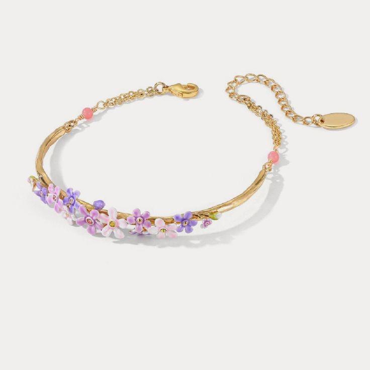 The aura of romance that surrounds forget-me-not flowers makes these bracelets special gifts for women at any occasion. Taking on timeless design, these flower bracelets go with any outfits. Dipped in 18K gold and sophisticatedly enamelled, these bracelets look elegant and luxurious around your wrist. DETAILS Plating: 18K Gold Materials: 18K Gold on Brass, Enamel Measurements: Length: 8.67" (22cm) + Extender: 1.97" (5.0cm) Weight: 7.3 g Hypoallergenic design Simple Gift Wrapping, Simple Gifts, Flower Bracelet, Nature Bracelets, Forget Me Not, Nature Jewelry, Flower Making, Gold Material, Favorite Things Gift