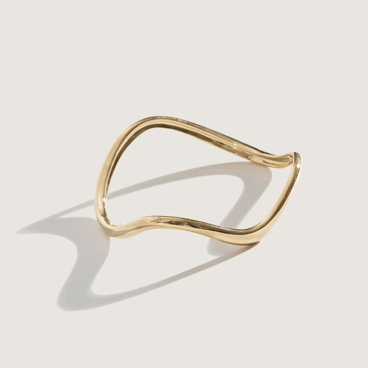 The Ophelia collection is inspired by my Nanny Ophelia, who first introduced me to jewelry. Each bangle has subtle movement to add something special to a classic everyday bangle. Available in 14K Gold Plate, 14K Gold Vermeil, and Sterling Silver Approximately 0.22" Width Small circumference approximately 2.4" Medium circumference approximately 2.5" Large circumference approximately 2.6" Handmade in NYC In stock items ship in 1 - 4 days Timeless 14k Gold Bangle, Adjustable 14k Gold Bangle With Polished Finish, Modern 14k Gold Hoop Bracelets, Modern 14k Gold Hoop Bangle, Elegant Everyday Brass Bangle, Elegant Brass Bangle For Everyday Wear, Adjustable 14k Gold Bangle, Fine Jewelry, Minimalist 14k Gold Bangle, Elegant Yellow Gold Bangle For Everyday