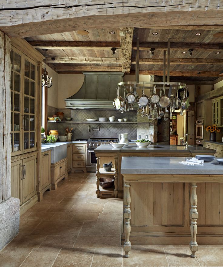 a large kitchen with an island in the middle