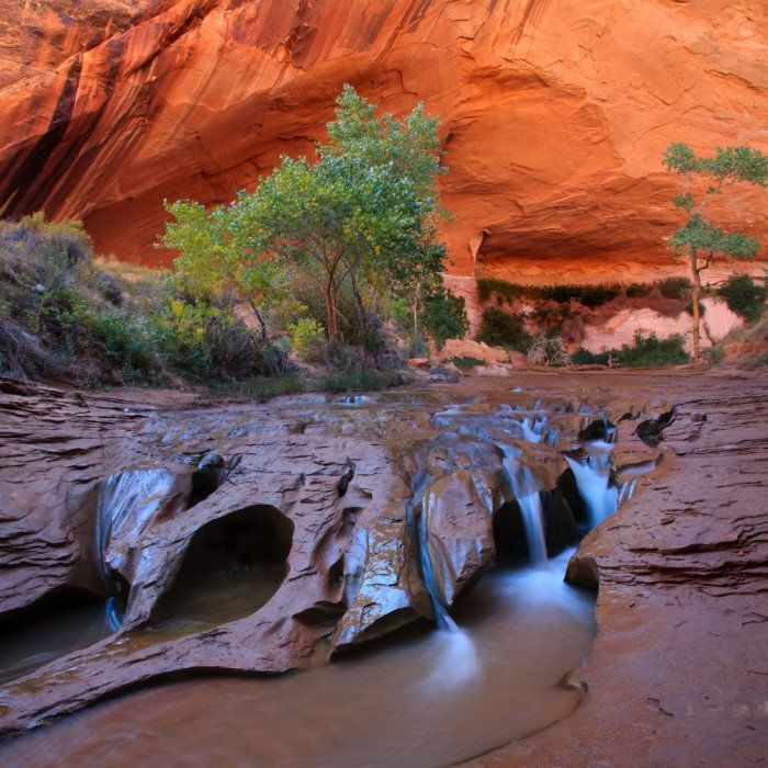 the water is running down the rocks in the canyon