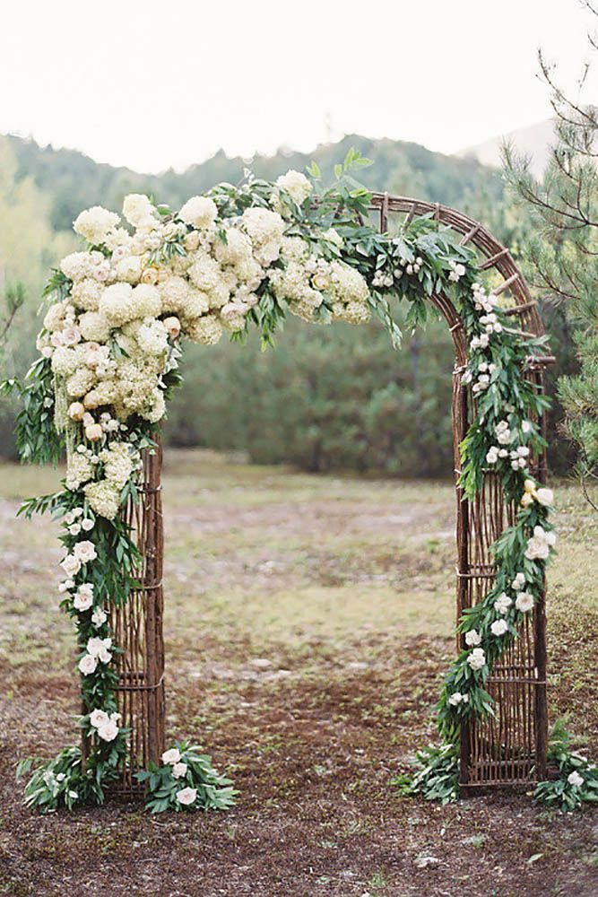 an image of a wedding arch with white flowers on it and the words, the country rustic