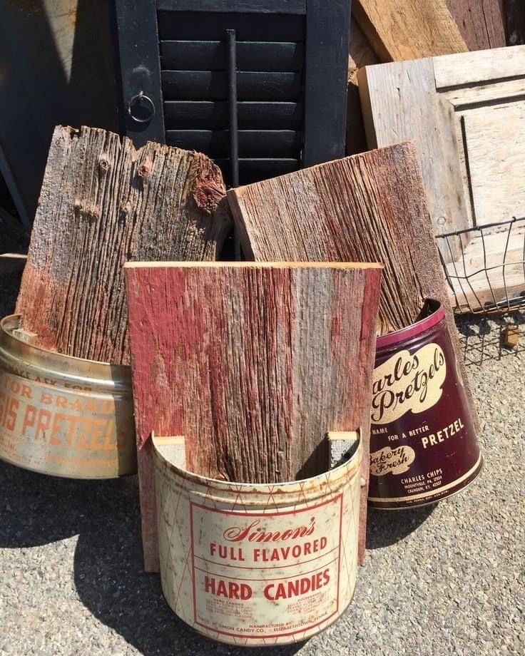 three buckets are sitting on the ground next to each other and one is empty