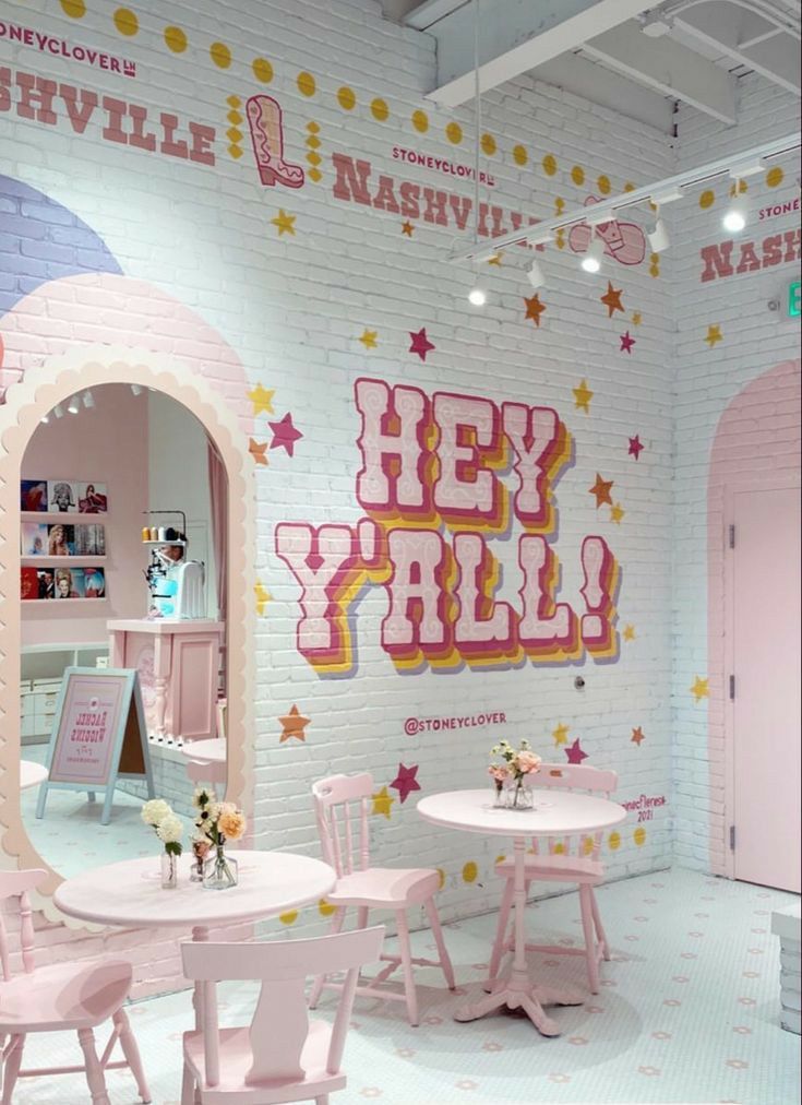 the interior of a children's playroom with pink furniture