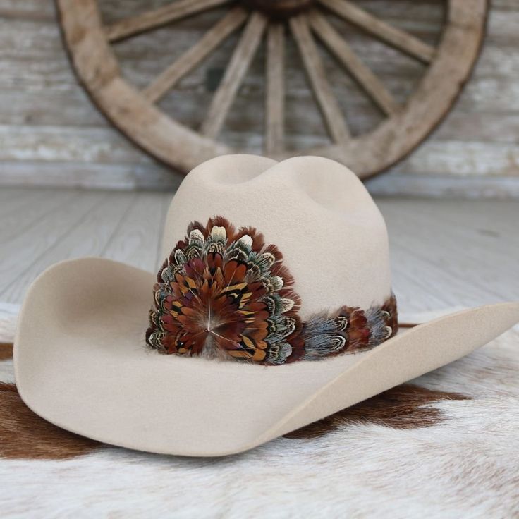 The Rowan (short) is a smaller version of our best selling hat band. Specially designed for small sized hats (6 7/8 and under) and kids hats.    100% Feather  Length: approx. 53cm (not including leather ties)  Width: 2cm  Crest dimensions: 4"w X 3.25"h Country Style Flat Bill Hat For Country Events, Adjustable Fit Flat Brim Hat For Country Events, Western Style Top Hat With Adjustable Short Brim, Western Flat Bill Hat, One Size Fits Most, Western Style Flat Bill Hat, One Size Fits Most, Western Style Flat Bill Hat, Adjustable Western Top Hat For Kentucky Derby, Western Hat Bands For Country Events, Adjustable Brown Hat Band For Country Events