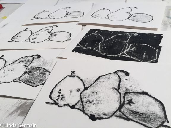 several drawings of fruits and vegetables on paper