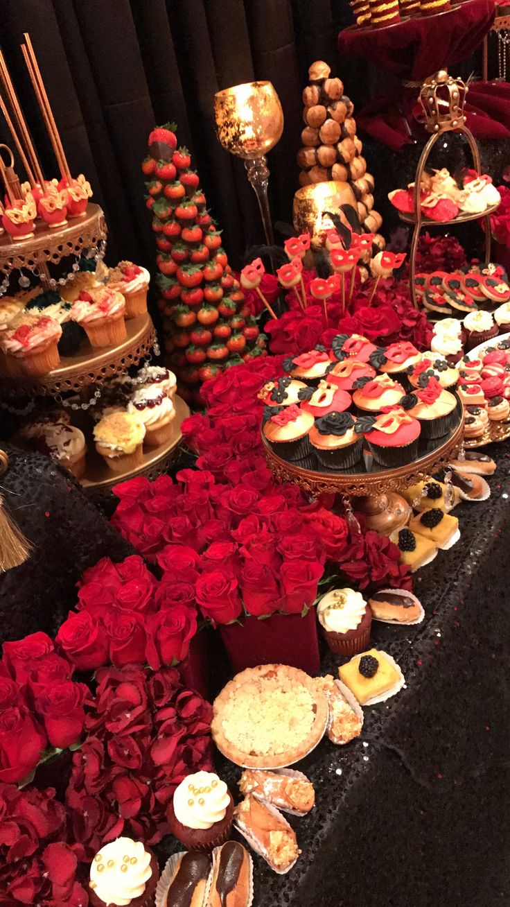 a table topped with lots of desserts and pastries