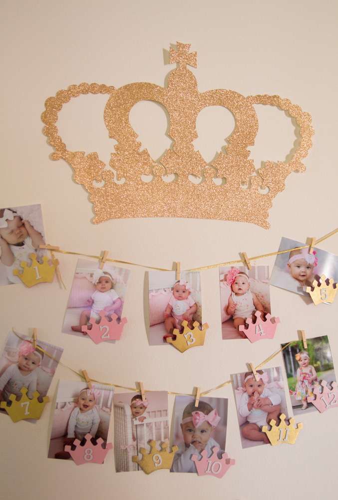 an image of a princess crown with photos hanging from it's clothes line and pinned to the wall