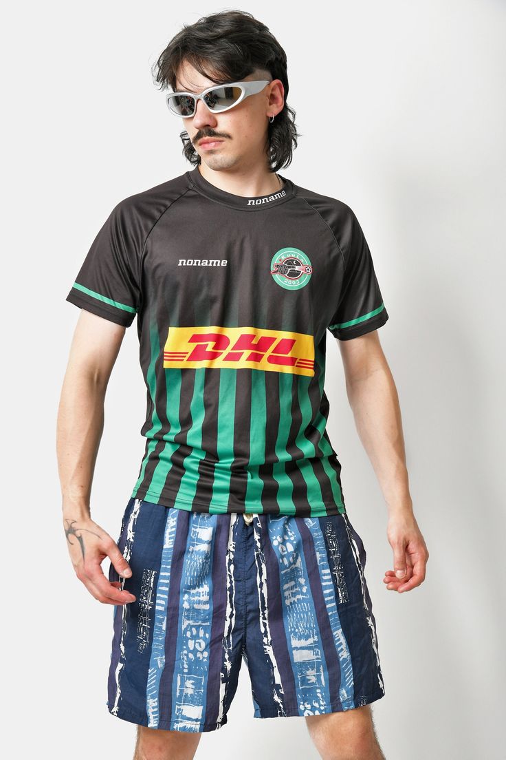 🚀Need to get your order super fast? Choose DHL Express shipping upgrade in your cart. It takes only 1-2 b. days to European Union countries and 2-5 b. days to USA, Canada and all other countries. Orders are ready to ship in 1 b. day. 🔥Y2K vintage soccer sport shirt in black green with DHL print and number 14 on the back by Noname. Size - S/M (L on the tag, but looks like S/M). Model is 177 cm / 5ft 9.6" tall and usually wears size M. Very good condition. Unisex. Only 1 available! All orders ar Casual Black Football Season Jersey, Casual Black Jersey For Football Season, Short Sleeve Jersey With Graphic Print For Football Season, Black Short Sleeve Jersey For Streetwear, Green Short Sleeve Jersey For Sports Events, Black Crew Neck Jersey For Streetwear, Casual Black Short Sleeve Jersey, Sporty Black T-shirt For Football Season, Casual Green Jersey For Streetwear