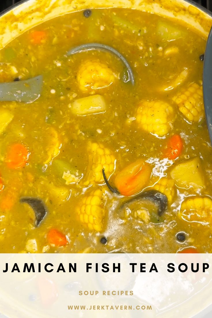 jamaican fish tea soup with corn and carrots in a pot on the stove top