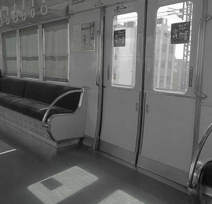 a black and white photo of the inside of a train