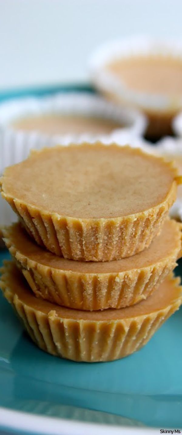 three peanut butter tarts stacked on top of each other in front of the rest of the tarts