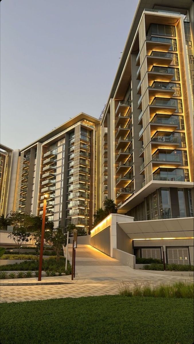 an apartment building with many balconies and lights