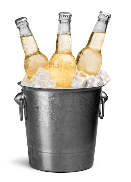 three bottles of beer are in an ice bucket with ice cubes on the bottom