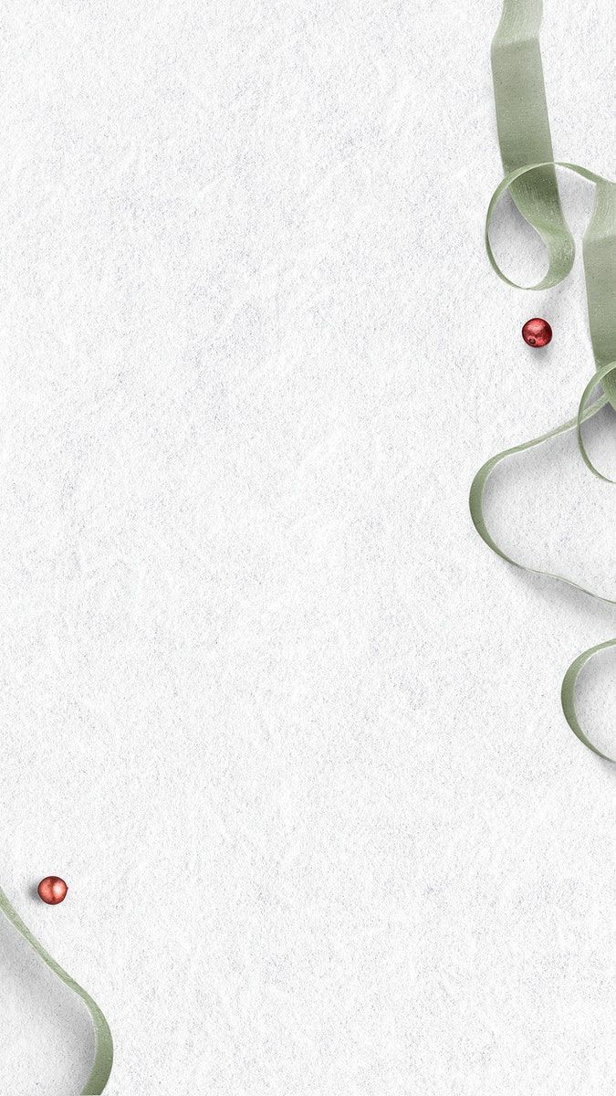 a white background with green ribbons and red balls