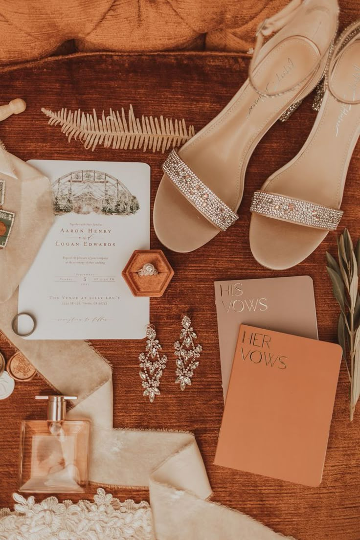 the contents of a wedding suite laid out on a table