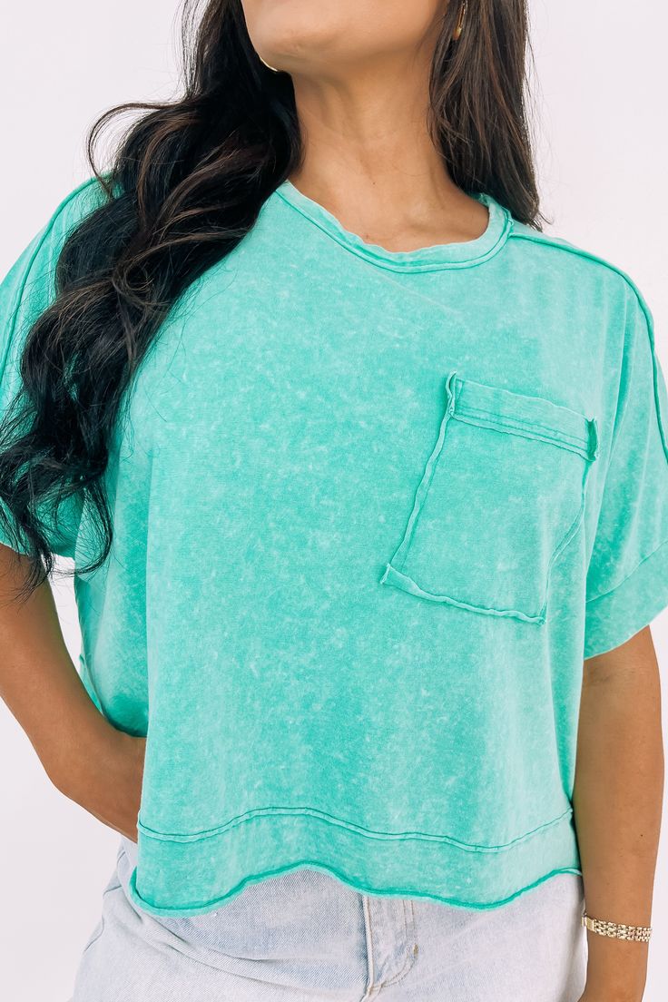 This oversized crop top features a round neckline, short sleeve, dolman sleeve, drop shoulder, patch pocket, oversized crop fit, exposed hem detailing, and mineral washed. 100% Cotton Machine Wash Cold. With Like Colors. Gentle Cycle. Do Not Bleach. Do Not Tumble Dry. Hang Dry. Low Iron. Dry Clean For Best Results. Bethany is 5'10 wearing a size Medium. Oversized Crop Top, Hanging Dryer, Low Iron, Tumble Dryer, Dolman Sleeve, Drop Shoulder, Patch Pocket, Round Neckline, The Go