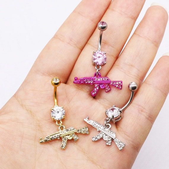 Dangle Belly Button Ring Gun Shaped Belly Ring CZ Belly | Etsy Unique Belly Rings, Cute Belly Rings, Belly Button Piercing Jewelry, Belly Piercing Jewelry, Belly Piercing Ring, Belly Jewelry, Navel Ring, Belly Piercing, Belly Button Ring