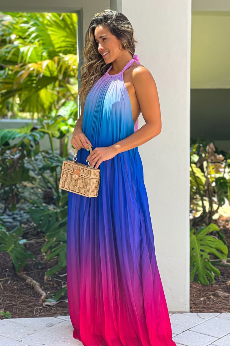 How stunning is this Pink And Purple Halter Neck Maxi Dress! A gorgeous color block maxi that features a halter neckline and flowy look! A stunning style for your next event! 100% Polyester Approx. Length (shoulder to bottom hem): -Small: 56 " -Medium: 56.5 " -Large: 57 " Approx. Bust Size: -Small: 28 " -Medium: 30 " -Large: 32 " Approx. Waist Size: -Small: 40 " -Medium: 42 " -Large: 44 " Approx. Hips Size: -Small: 54 " -Medium: 56 " -Large: 58 " Model is 5’5, 32 B bust, size 2/4 pants, size small top, and is wearing a size small. Loose Fit Halter Neck Color Block Cinched at Waist Pleats Open Back Elastic Band on Lower Back Lined Hand Wash Cold Hang or Line Dry Color: Pink, Purple, Blue *Filter Added to Main Picture. Color May Change. Leisure Dress, Night Skirt, Blue Filter, Halter Neck Maxi Dress, Dress Party Night, Saved By The Dress, Stunning Style, Maxi Dress Sale, Printed Dresses