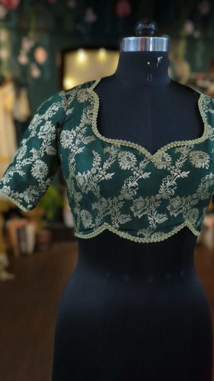 Beautiful and stylish blouse in brocade with floral design.  This blouse can be done with or without the bust cup inserts . The blouse is fully lined is cotton. Elegant Green Top For Reception, Green Blouse With Floral Embroidery For Reception, Green Floral Embroidered Blouse For Reception, Saree Blouse With Lace Work For Reception, Cotton Silk Blouse For Reception And Festivals, Elegant Cotton Silk Tops For Festivals, Green Fitted Top For Reception, Fitted Green Top For Reception, Bollywood Style Blouse With Lace Work For Reception