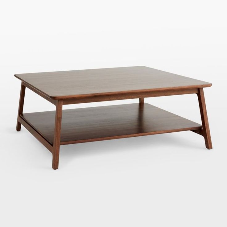 a wooden coffee table sitting on top of a white floor